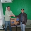 O presidente do Sitracover entrega o prêmio ao associado ganhador - Sr. Juliano Machado Crema da empresa Santa Catarina  